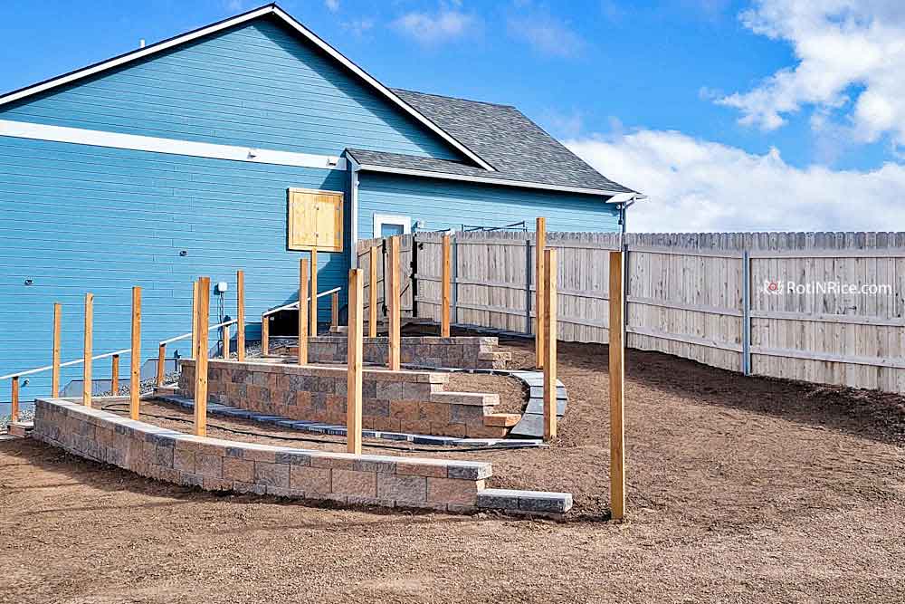 Three retaining walls needed to create three levels of planting areas.
